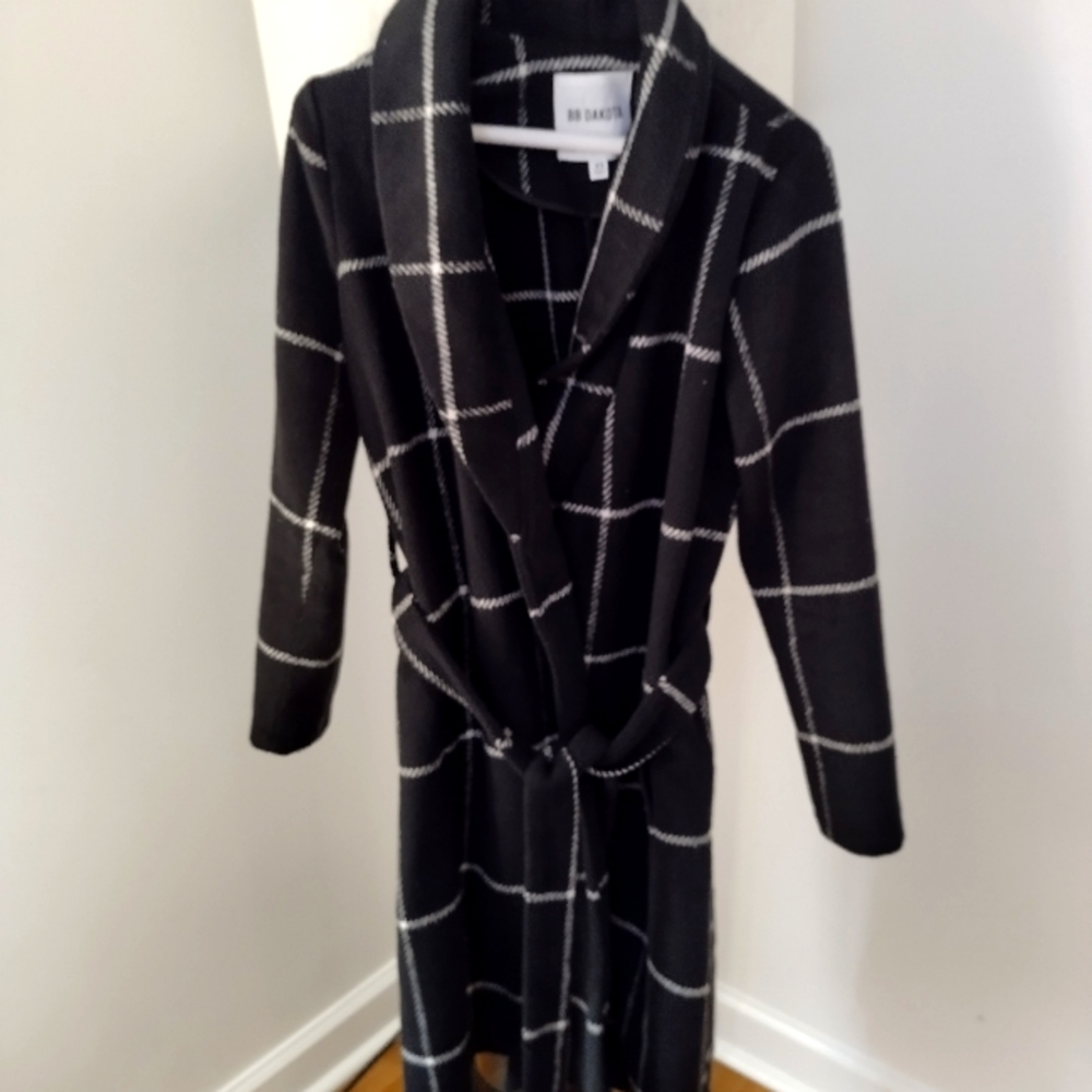 A beautiful black and white coat .